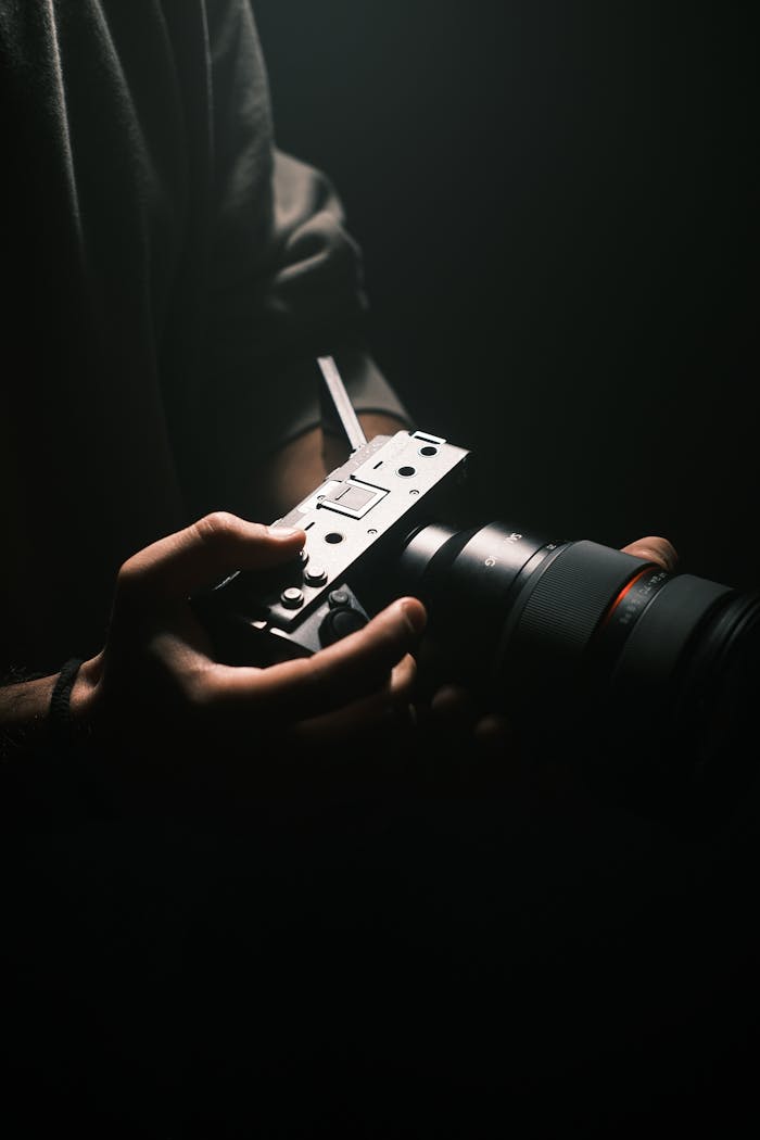 Services Close-up of professional filmmaking gear in a dramatic low light setting.